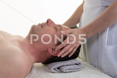 Cranial Osteopathy Therapy In A Medical Room, Hands Of Female