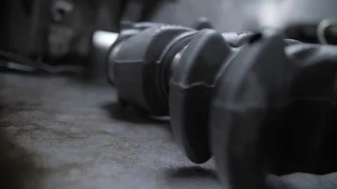 Crankshaft of automobile engine lies on the table Stock Footage 162844159