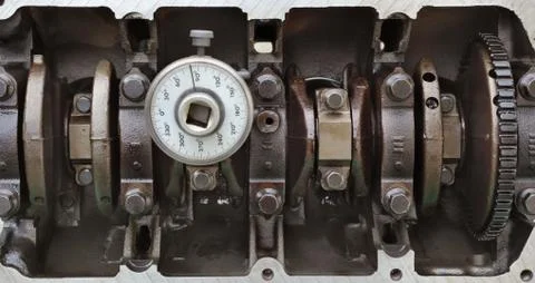 Crankshaft of car engine with angle measuring tool Stock Photos
