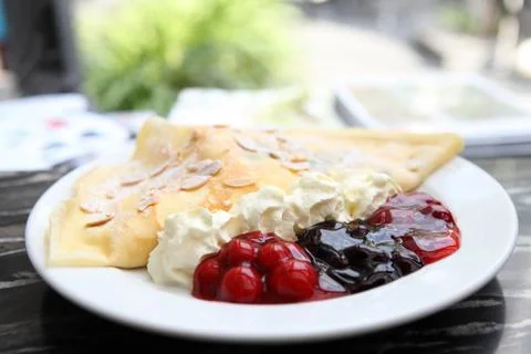 Crape cake with berry sauce Stock Photos