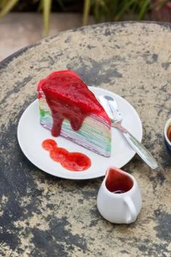 Crape cake rainbow and hot espresso coffee Stock Photos