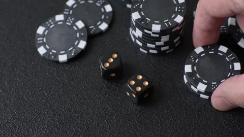 Craps is a casino game played with two dice and chips. Craps with two dice Stock Footage 332988744