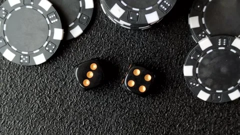 Craps is a casino game played with two dice and chips. Craps with two dice Stock Footage 332988939