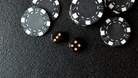 Craps is a casino game played with two dice and chips. Craps with two dice Stock Footage 332988943