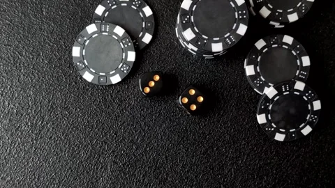 Craps is a casino game played with two dice and chips. Craps with two dice Stock Footage 332988957