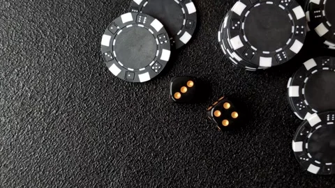 Craps is a casino game played with two dice and chips. Craps with two dice Stock Footage 332988962