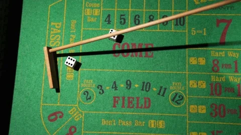 Craps dealer pulls back rolled dices Stock Footage 153951156