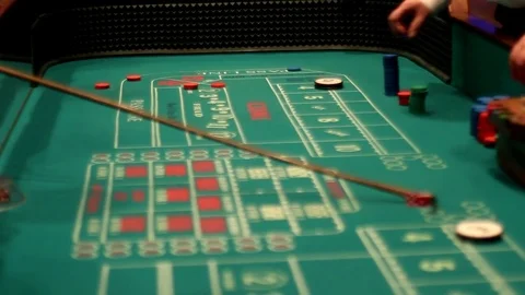 Craps table with black men playing Stock Footage 77524150