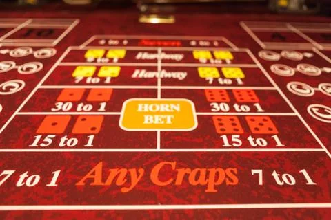 Craps table with red felt Stock Photos