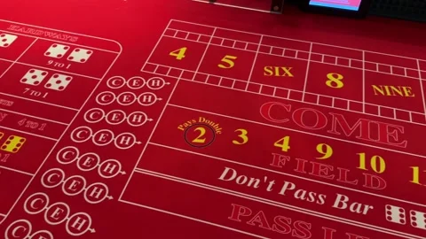 Craps table with red velvet table top in casino, dice game, Panning View Stock Footage 259173834