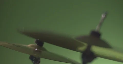 Crash cymbal being hit by drum stick in slow motion Stock Footage 99990874