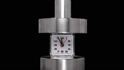 Crash test alarm clock, hours under hydraulic press, close-up Stock-Footage 94141154