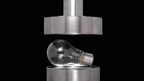 Crash test light bulb under hydraulic press, close-up Stock-Footage 94142339