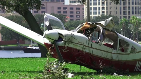 Crash Wreckage Of A Small Plane On Grass Field Close Up 02 4K Stock Footage 41786761