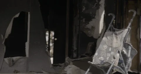 Crash Zoom into Stroller Inside Burnt Out Home Stock Footage 89942276