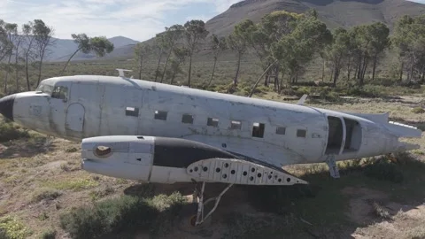 Crashed abandoned plane wreck in remote rural landscape Stock Footage 344517549