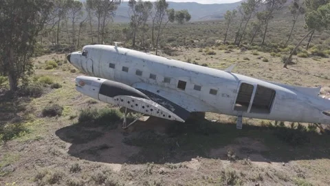 Crashed abandoned plane wreck in remote rural landscape Stock Footage 344773484