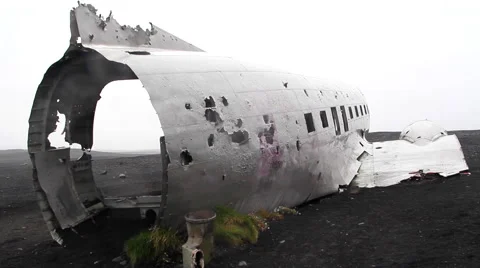 Crashed aircraft over lava field, dolly camera back Stock-Footage 57329699