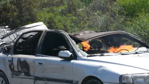 Crashed and burning car on fire Stock Footage 155865186