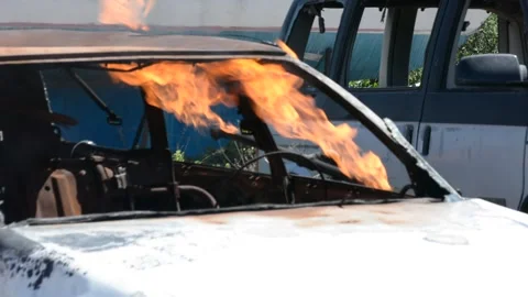 Crashed and burning car on fire 库存影片 155865197
