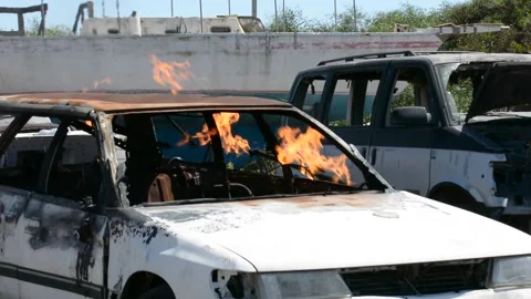 Crashed and burning car on fire Видео 155865199