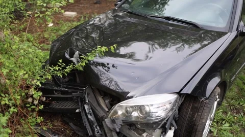 Crashed car after accident in Kuwait damaged front hood broken bumper black vehi Stock Footage 307142829
