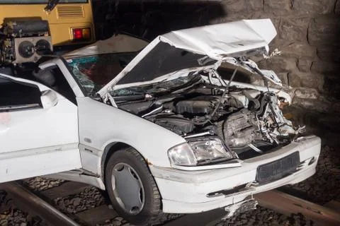 Crashed car in train accident Stock Photos
