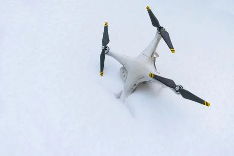 The crashed Drone. Fallen in snow. Phantom 3. Stock Photos