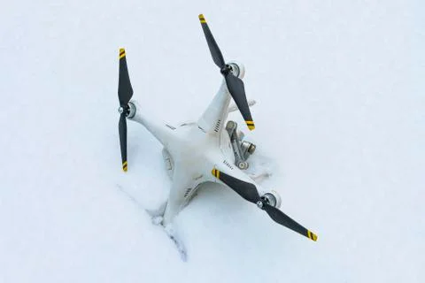 The crashed Drone. Fallen in snow. Phantom 3. Stock Photos