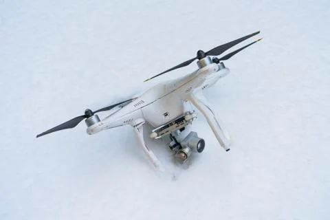 The crashed Drone. Fallen in snow. Phantom 3. Stock Photos