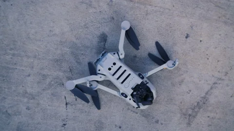 Crashed drone on a gray background with a broken camera Stock Footage 170156888