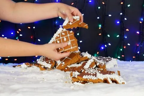 The crashed hand-made eatable gingerbread house, snow decoration Stock Photos