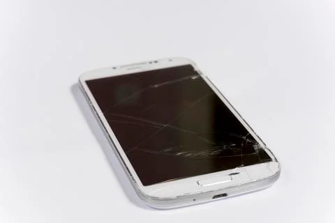 Crashed lcd touch screen on the white mobile phone Foto stock