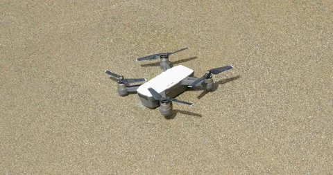 Crashed mini drone into the ocean. Stock Footage 218450095
