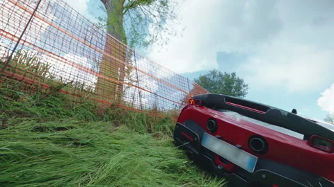 Crashed sport car waiting to be loaded on tow truck, car accident on the road 動画素材 345438373