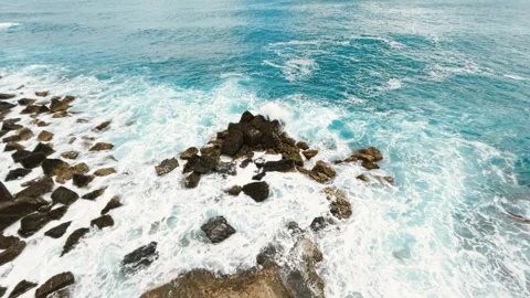 Crashing ocean waves into rocks Stock Footage 242339809