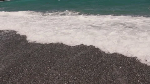 Crashing sea waves on empty pebble beach, slow motion Stock Footage 131141475