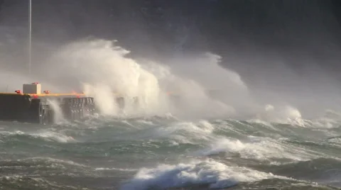 Crashing waves against pier docks, heavy sea spray, hurricane gale force wind Stock Footage