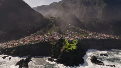 Crashing waves and dramatic light highlight resilient island Stock Footage 320741674