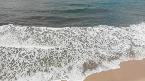 Crashing waves on the beach 5 Stock Footage 95057373