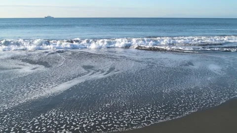 Crashing waves at the beach and ship in the distance, Kanagawa Prefecture, Japan Stock Footage 235401767