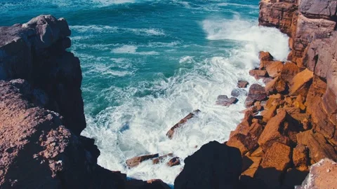 Crashing waves creating huge splashes.  Ocean Waves at high tide roll in Stock Footage 329694394