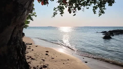 Crashing waves with golden sunlight reflection along Batu Topeng Beach Stock Footage 342316290