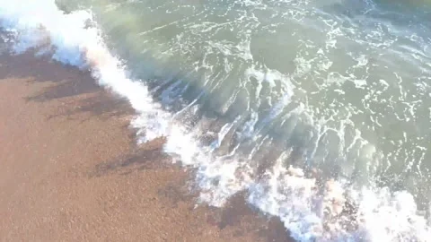 Crashing Waves over a beach Stock Footage 141924663