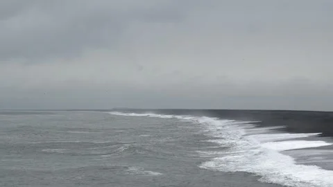 Crashing waves on a remote black sand beach in Iceland 4K nature footage Stock Footage 339925890
