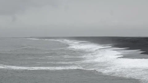 Crashing waves on a remote black sand beach in Iceland 4K nature footage Stockbeeldmateriaal 339926266
