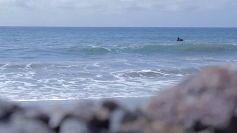 Crashing Waves with Rocks in the Foreground Stock Footage 99307517