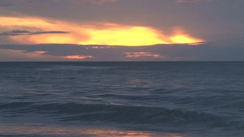 Crashing waves at sunset Stock Footage 74073153