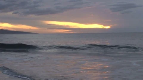 Crashing waves at sunset Stock Footage 74073164