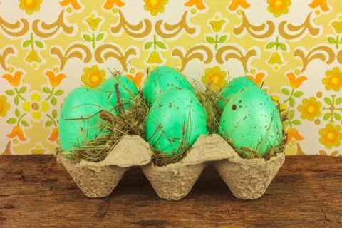 Crate with easter eggs on a wooden table Stock Photos